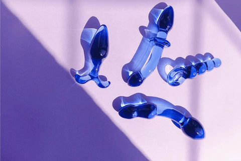 Image of a range of sex toys under £50 on a purple surface.